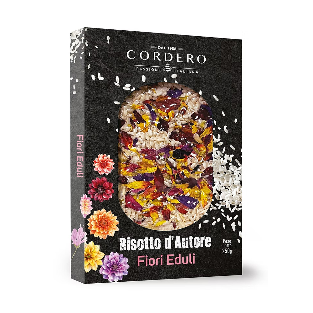 Il Risotto d’Autore Cordero ai Fiori Eduli è un piatto elegante e raffinato che unisce la qualità del riso Carnaroli al fascino dei petali colorati di fiori commestibili. Un mix unico che trasforma ogni preparazione in un’esperienza visiva e gustativa sorprendente. Realizzato con ingredienti selezionati, il risotto acquista profumi delicati e note floreali che lo rendono perfetto per stupire a tavola con un piatto tanto buono quanto scenografico. La confezione, curata come un piccolo quadro, presenta il riso disposto come un candido fondale impreziosito dai fiori variopinti: un invito a cucinare con creatività e stile.