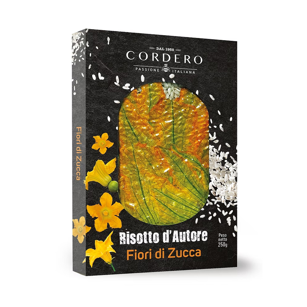 Il Risotto d’Autore Cordero ai Fiori di Zucca è un piatto elegante e raffinato che unisce la qualità del riso Carnaroli al delicato aroma dei fiori di zucca. Un mix unico che trasforma ogni preparazione in un’esperienza visiva e gustativa sorprendente. Realizzato con ingredienti selezionati, il risotto acquista profumi delicati e note floreali che lo rendono perfetto per stupire a tavola con un piatto tanto buono quanto scenografico. La confezione, curata come un piccolo quadro, presenta il riso disposto come un candido fondale impreziosito dai fiori variopinti: un invito a cucinare con creatività e stile.